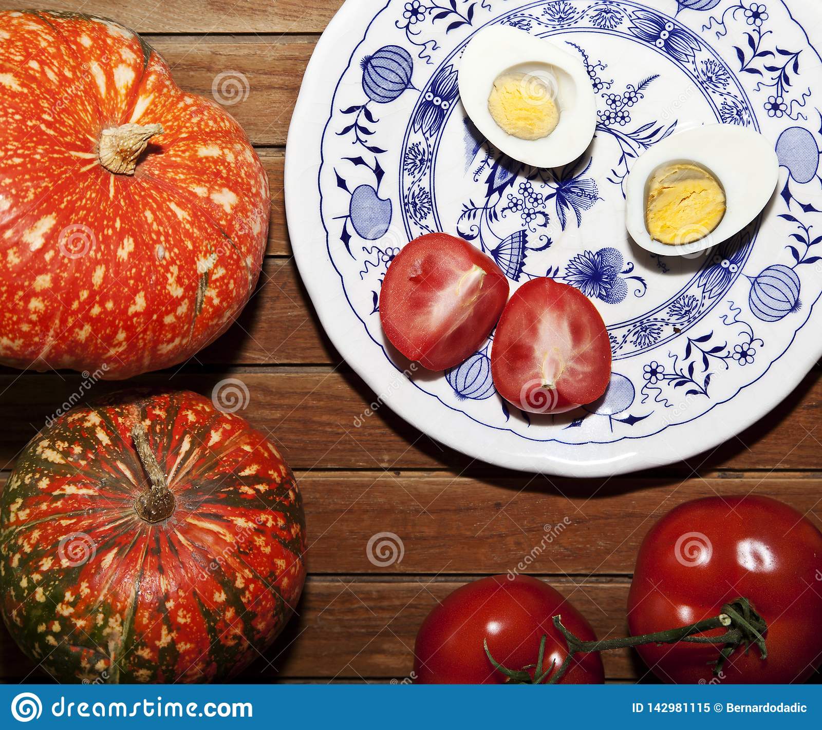 Cooked Egg and Tomato on a Wooden Table Stock Image